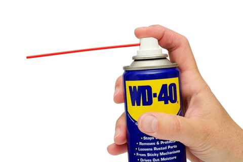 WD 40 spray lubricant can against a white background