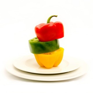 Multicolored bell peppers in a plate