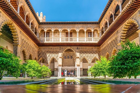 Moorish architecture of beautiful castle called Real Alcazar in Seville