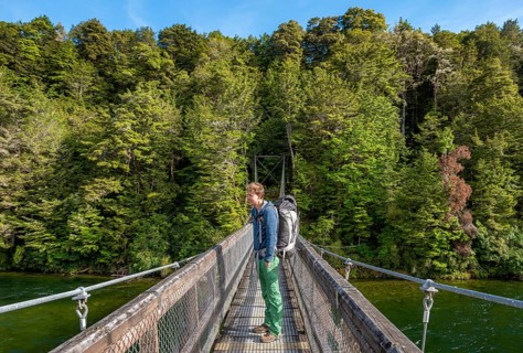 Hiker on suspension bridge