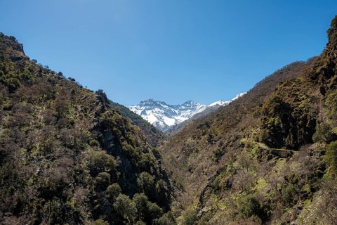 View of snow-covered mountains of the Sierra Nevada with summits Mulhacen and La Alcazaba