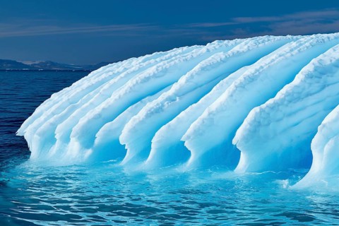 Rugged iceberg drifting through Icefjord