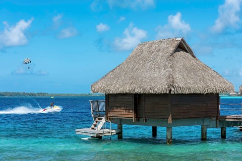 Water sports and overwater bungalow in the lagoon