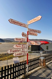 International names of capitals on signposts next to the runway