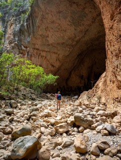 Hiker stands in a gorge