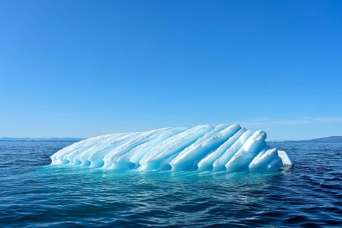 Iceberg drifts through Icefjord
