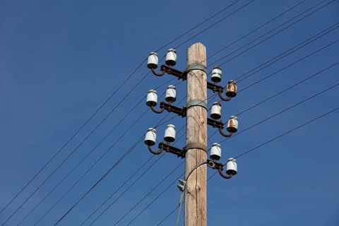 Old power pole with ceramic insulators