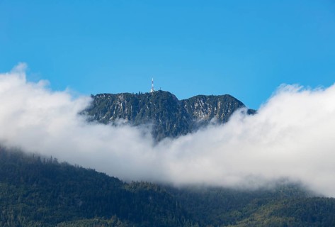 Band of clouds around mountain peak Katrin