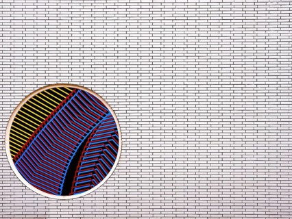 Part of a brick wall with a circular mosaic