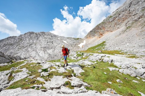 Hiker on hiking trail around the Funtenseetauern