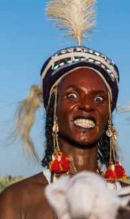 Wodaabe-Bororo man with his face painted at the annual Gerewol festival