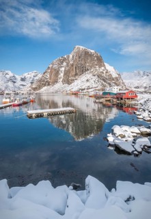 Rorbuer fishermen's cabins on the snowy fjord