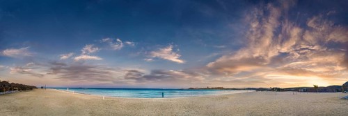 Sandy beach beach and coral reef Abu-Dabbab at sunset