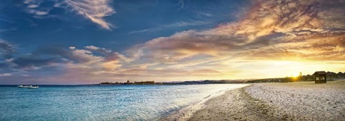 Sandy beach beach and coral reef Abu-Dabbab at sunset