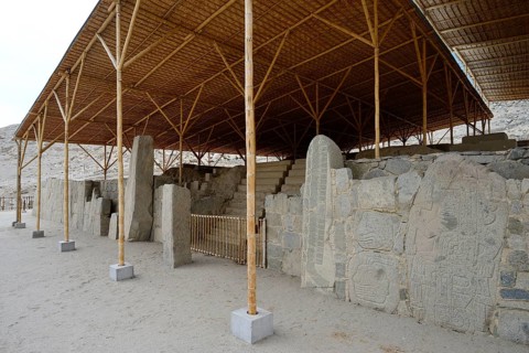 Wall with depictions of warriors and heads