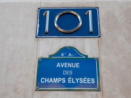 A plaque with the number 101 and a plaque with the name of the Avenue des Champs-Elysees