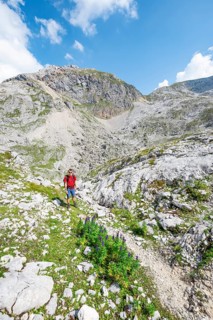 Hikers in a landscape of washed out karst rocks