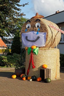 Decorated bale of straw figure for the harvest festival