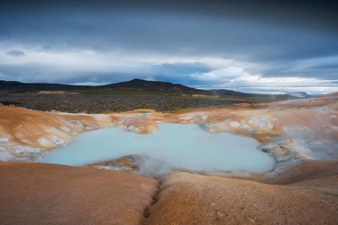 Turquoise lake in the lava river Leihrnjukur in the Krafla