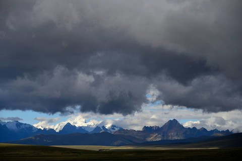Mountain range of the Cordillera Blanca under dark clouds