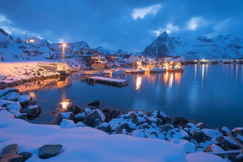 Port of the fishing village Hamnoy Polar Night in winter