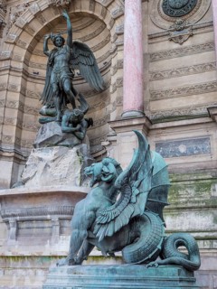 Bronze statue of the fountain La Fontaine Saint Michel at Place Saint-Michel
