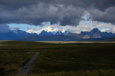 Mountain range of the Cordillera Blanca under dark clouds
