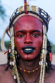 Wodaabe-Bororo man with face painted at the annual Gerewol festival