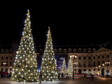 Night shot of illuminated Christmas trees at Place Vendome