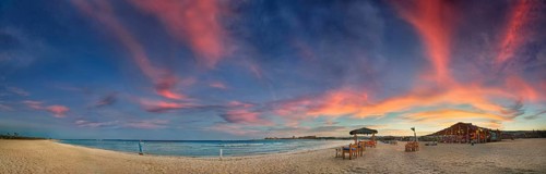Sandy beach beach and coral reef Abu-Dabbab at sunset