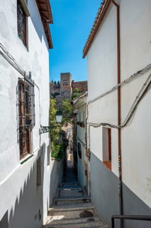Alley with view of the towers of the Alhambra