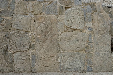 Wall with depictions of warriors and heads