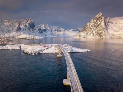 Snowy landscape by the fjord with Hamnoy bridge