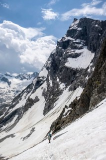 Hiker crosses snow field