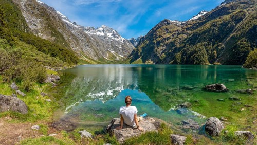 Hiker sitting on the shore