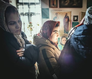 Believers during an exorcism in the church of Father Sergei in Ochamchira