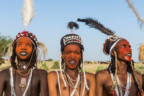 Wodaabe-Bororo men with faces painted at the annual Gerewol festival