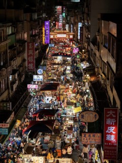 Busy pedestrian area at night