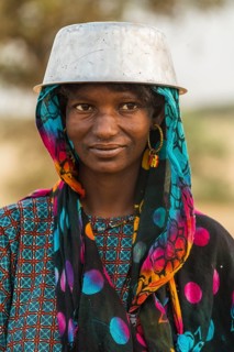 Young girl with a a water pot on her head