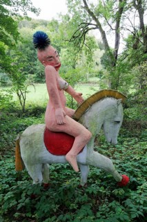 Naked Amazon riding a horse