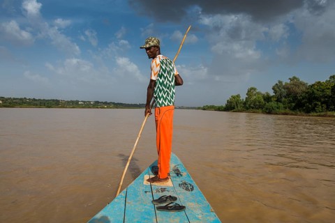 Man in front of a boat