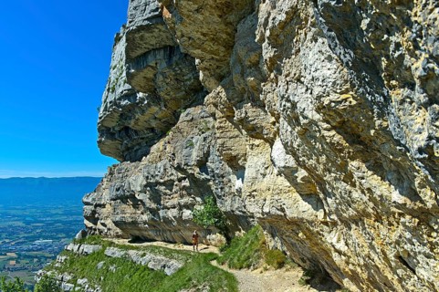 Narrow balcony path La Corraterie with panoramic view of the Geneva basin on the way to the summit Mont Saleve