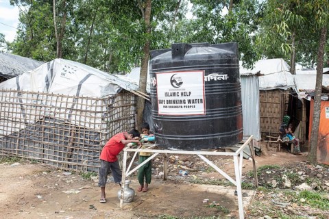 Children fetch water from a tank