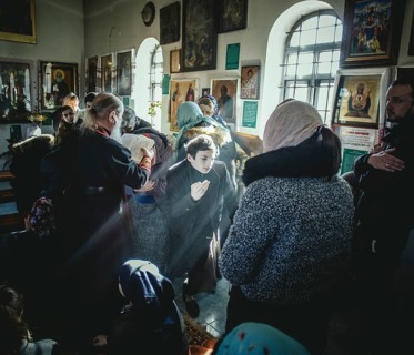 Father Sergei during an exorcism in his church in Ochamchira