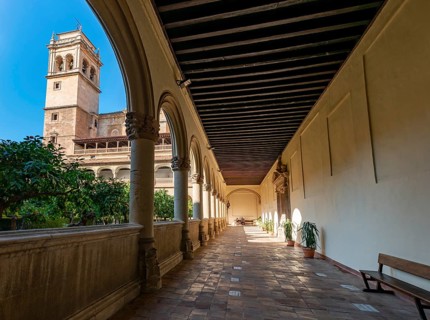 View of the church tower through arcades
