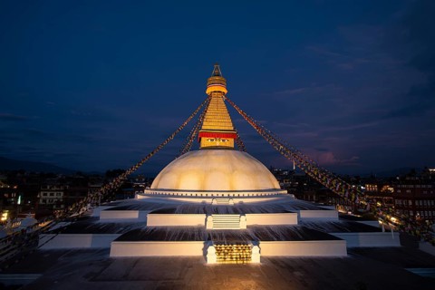 Boudha Stupa with the all-seeing eyes of Buddha in the evening light