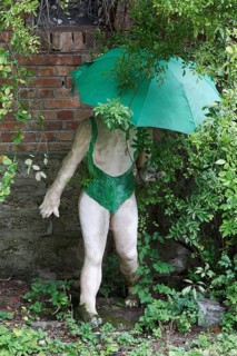 Woman in a bathing suit with umbrella