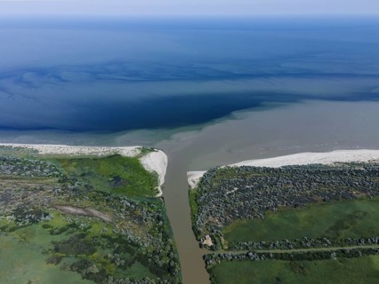 Aerial view on the distributary channel Danube river flowing into the Black Sea
