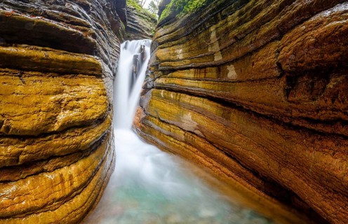The Taugl or Tauglbach flows through the red gorge