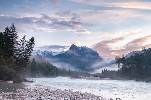River Soca with Svinjak Mountain in the morning